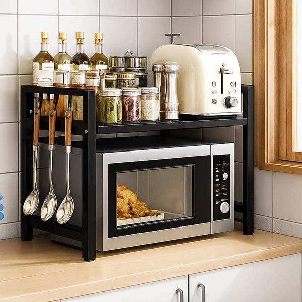 Microwave Shelf Organiser with toaster, and various kitchen items on a black rack.