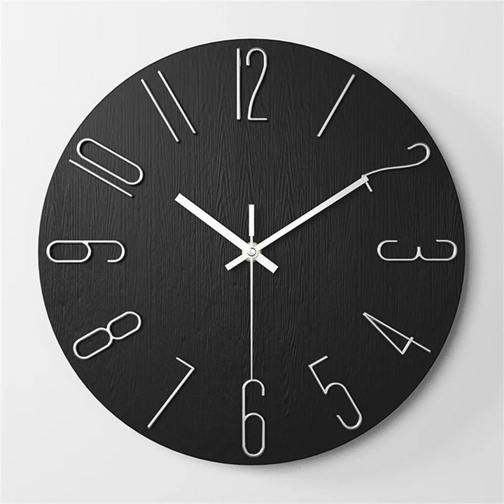 12inch Black wall clock with white numbers and hands on a light gray background