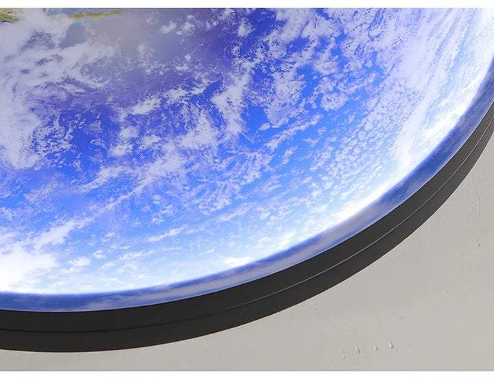 Close-up of GAIA 3D dimmable LED wall lamp showing Earth design, cool white light, modern ambient wall lighting.