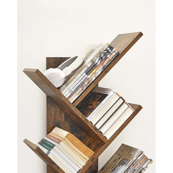 Wooden bookshelf with books and a white object on a white background