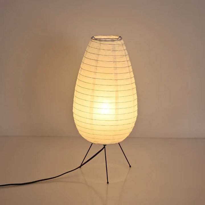 Tall teardrop rice paper table lamp with tripod stand, warm LED lighting for minimalist UK Nordic decor.