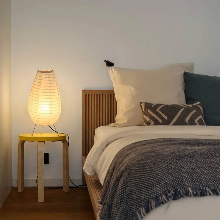AKARIS floor lamp with white rice paper shade and soft LED glow, styled in a UK Nordic-inspired bedroom