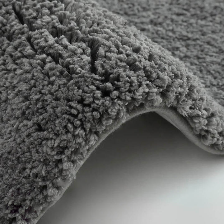 Plush dark grey memory foam bathroom rug with thick coral fleece surface for soft, spa-like comfort