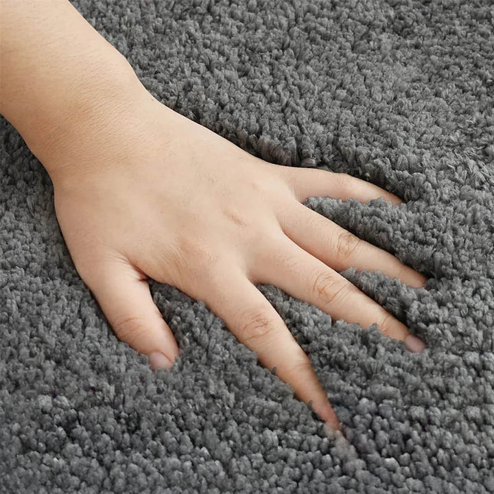 Thick grey bath rug with high-density memory foam and soft fleece, designed for daily bathroom use