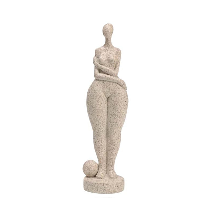 Statue of a woman balancing a sphere on her head against a white background
