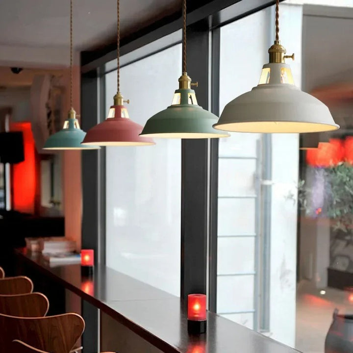 Colorful pendant lights hanging in a modern UK interior setting.