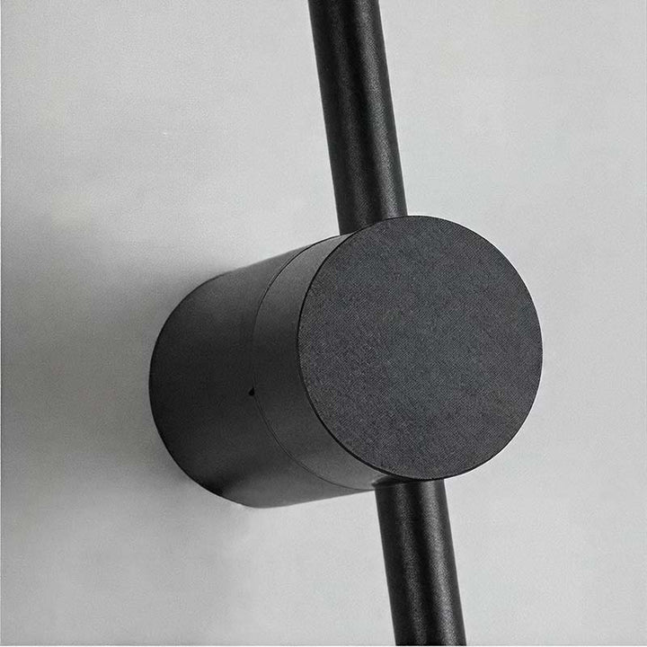 Black aluminium LED light bar with acrylic diffuser, part of a modern adjustable wall lamp for stylish indoor lighting.