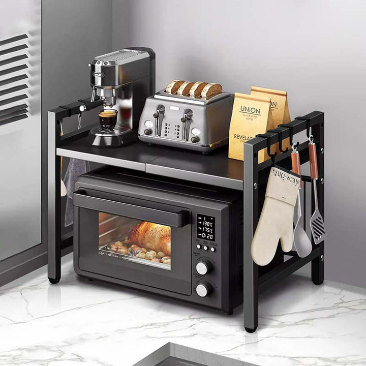 Kitchen oraganiser stand with microwave, toaster, coffee maker, and utensils on a marble floor.