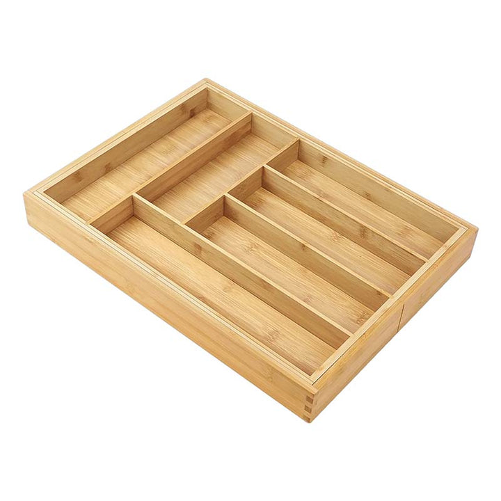 Wooden drawer organizer with multiple compartments on a white background