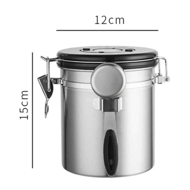 Silver stainless steel airtight coffee jar with black lid and scoop, measuring 12 cm × 15 cm.