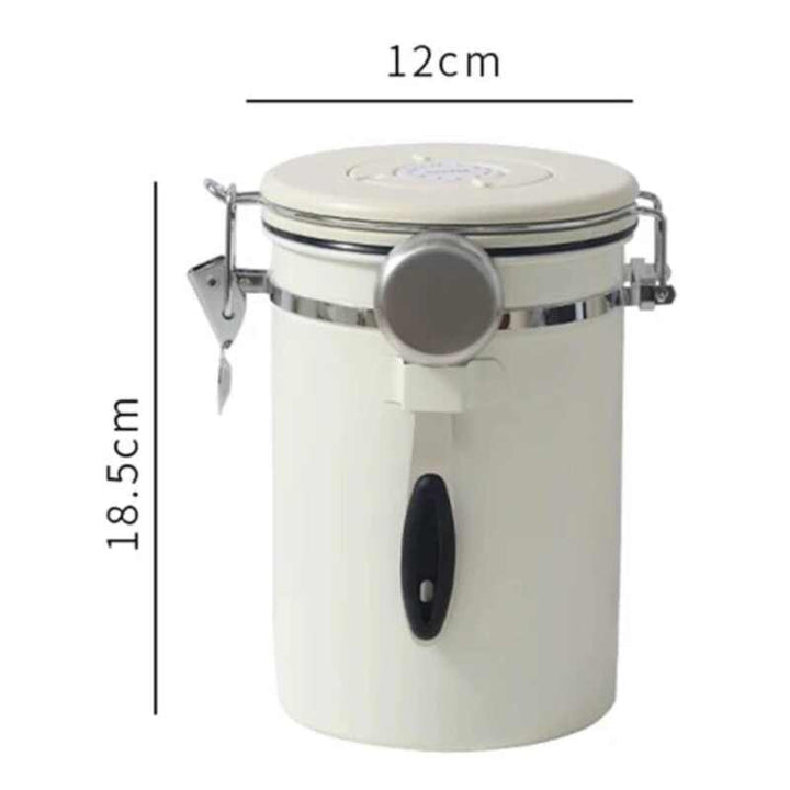 Tall cream airtight coffee storage jar with stainless steel scoop, measuring 12 cm × 18.5 cm.