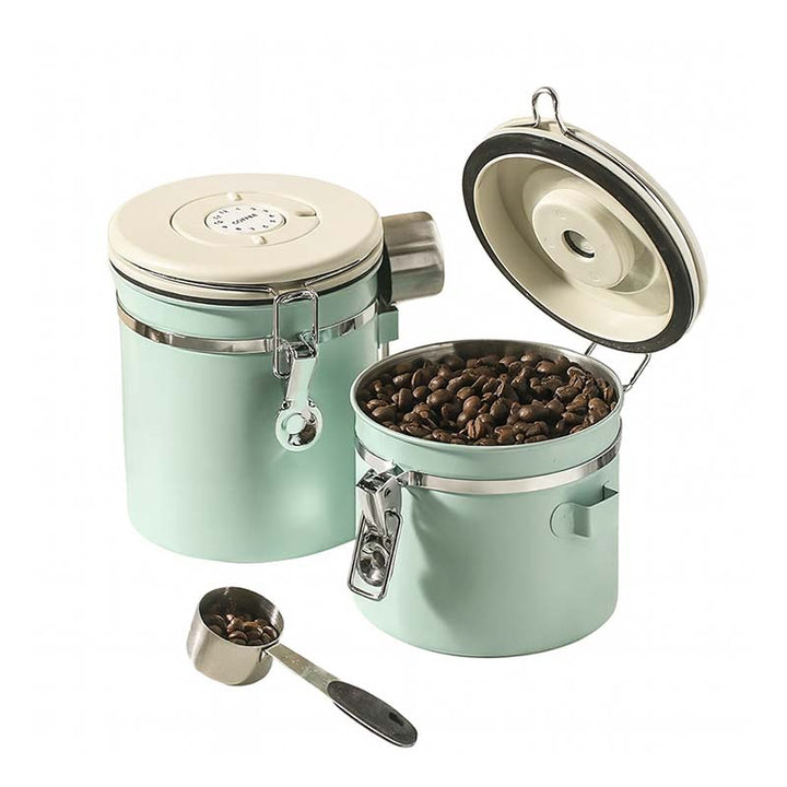 Mint green coffee container with a scoop on a white background