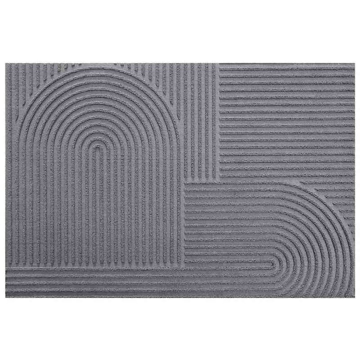 Minimalist grey door mat with a Time arc pattern, featuring quick-dry and water-absorbent qualities for indoor use.