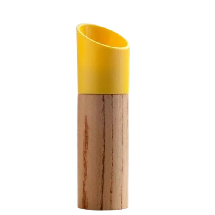 Beech wood kitchen grinder with the yellow grinding part on a white background