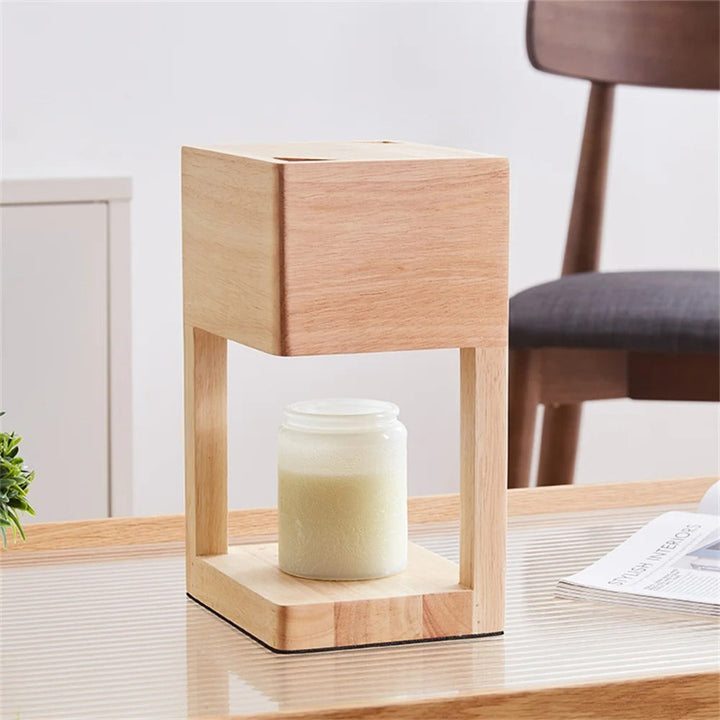 Light wood candle warmer lamp on tabletop, warming white jar candle, modern home décor