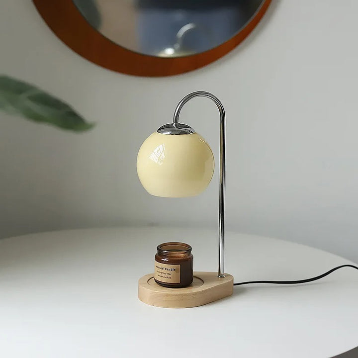 Candle warmer on a white surface.