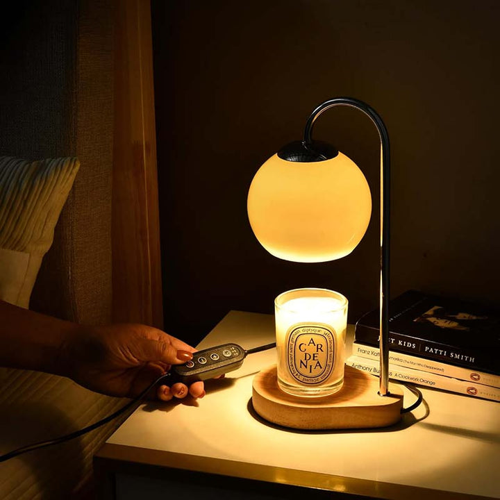 Candle Warmer with a candle glowing softly.