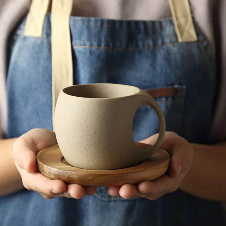 Unglazed porcelain ceramic mug with a smooth matte finish, paired with a natural acacia wood saucer—perfect for coffee, tea, or stylish home cafés.
