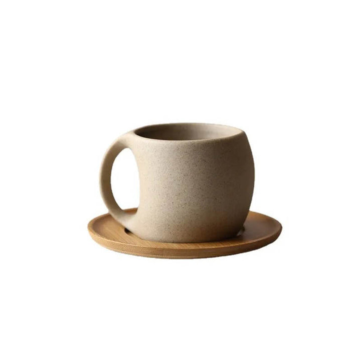 Unglazed porcelain ceramic mug with a smooth matte finish, paired with a natural acacia wood saucer—perfect for coffee, tea, or stylish home cafés.