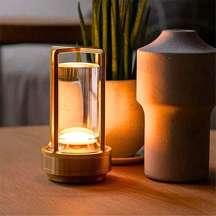 Gold USB rechargeable lantern with warm LED light, elegant cordless lamp for evening relaxation.