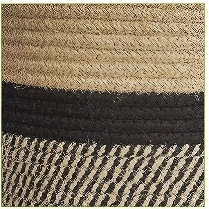 Close-up of black and natural jute weave pattern, highlighting contrast stitching on cotton rope plant basket.
