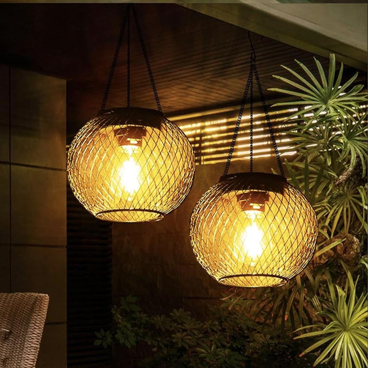 Solar-powered hanging garden lanterns mounted under roof eaves for patio lighting.