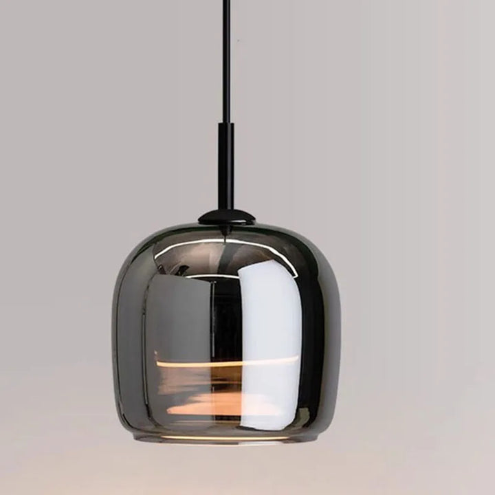 Modern nordic glass pendant light with smoked glass shade on a neutral background