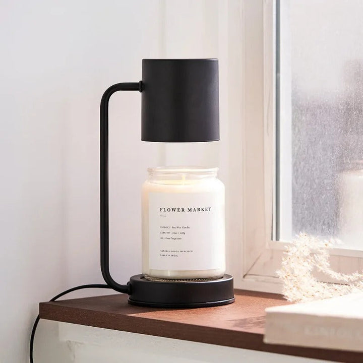 Matte black candle warmer lamp with cylindrical head and base, for jar candles on bedside or windowsill
