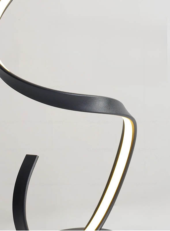 Close-up of curved aluminium LED lamp with matte black finish, anti-rust and hand-bent design detail