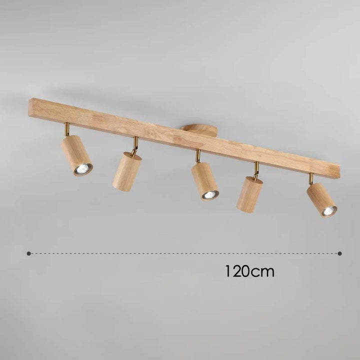 Wooden ceiling light fixture with five cylindrical lights on a gray background