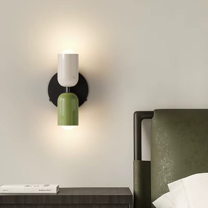 White and green minimalist LED wall lamp with black backplate in neutral bedroom decor