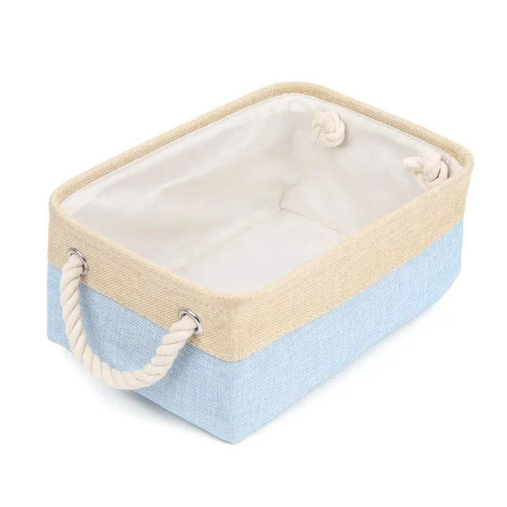 Rectangular storage basket with beige top and blue bottom on a white background