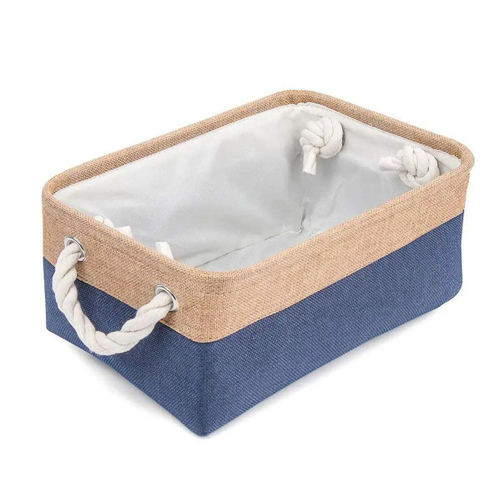 Storage basket with blue bottom and beige top on a white background