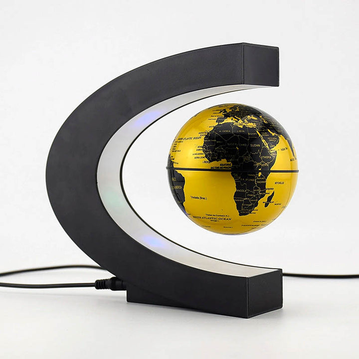 Gold magnetic levitation globe lamp with black world map and LED lights, modern floating night light for home and office decor