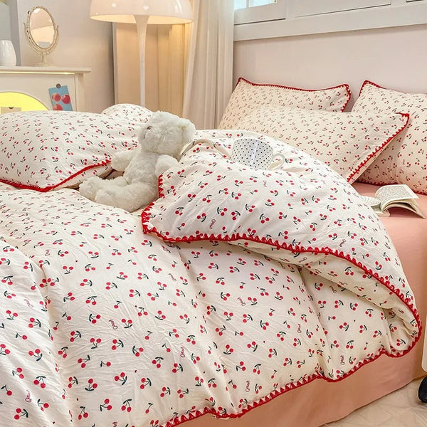 Soft cotton bedding set with cherry pattern and red trim, bringing playful Scandinavian charm to your bedroom