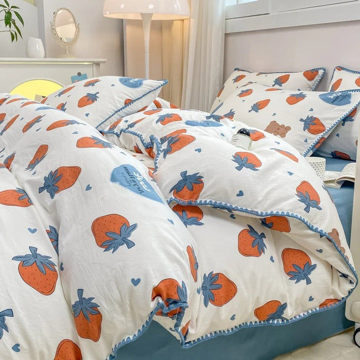 Strawberry print bedding set in blue and orange hues, blending fun design with cozy comfort