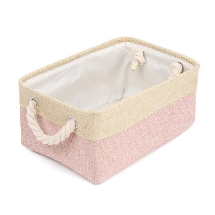 Storage basket with pink base and beige top on a white background