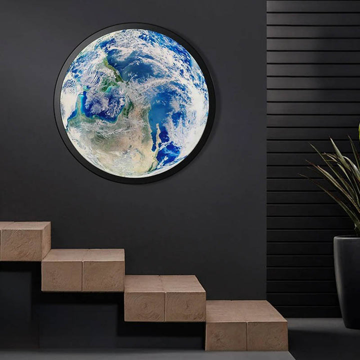 GAIA 3D Earth LED wall lamp mounted on dark wall, large circular ambient light for modern stairwell or living room.