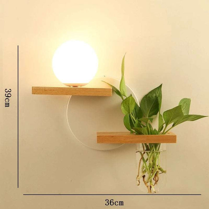 Decorative wooden LED wall lamp with circular backplate, warm globe light and planter holder, 39x36cm.