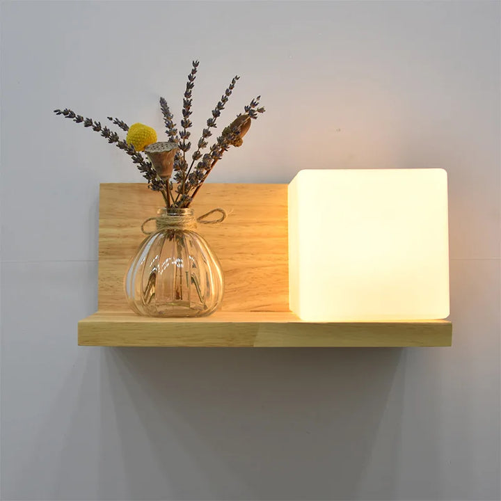 Modern wooden LED wall lamp with frosted cube light and glass vase holder, minimalist style.