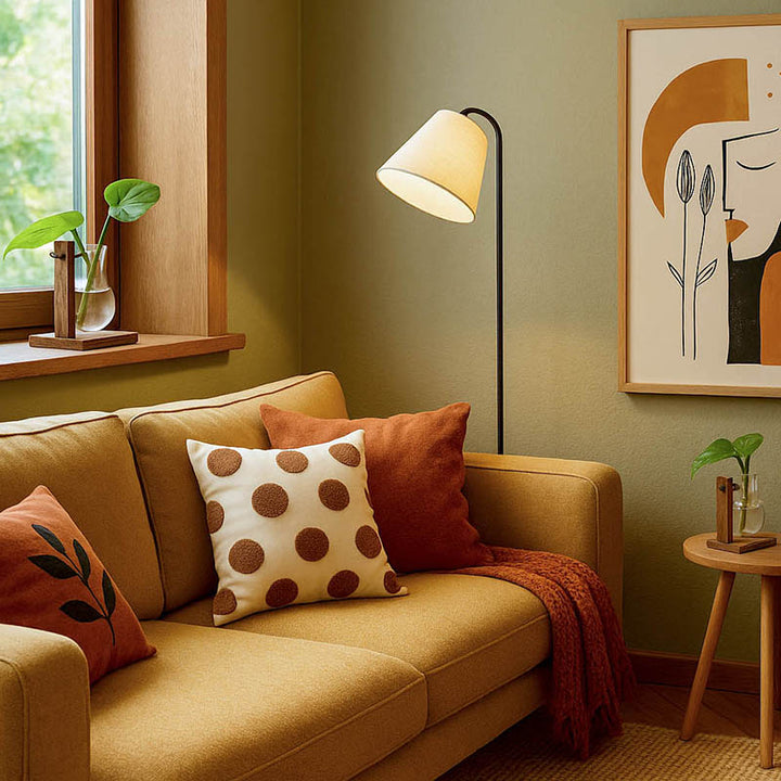 Stylish Nordic-style uk living room with hydroponic bulb vase planter on window ledge and side table for green touch.