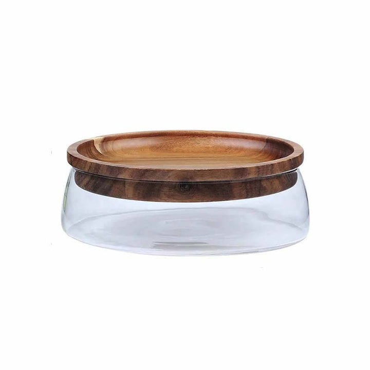 Side view of clear glass storage container with rich acacia wood lid, perfect for dry food and snacks.