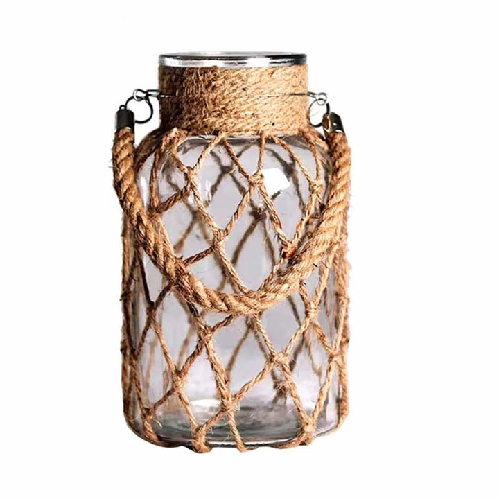 Glass vase with rope netting on a white background
