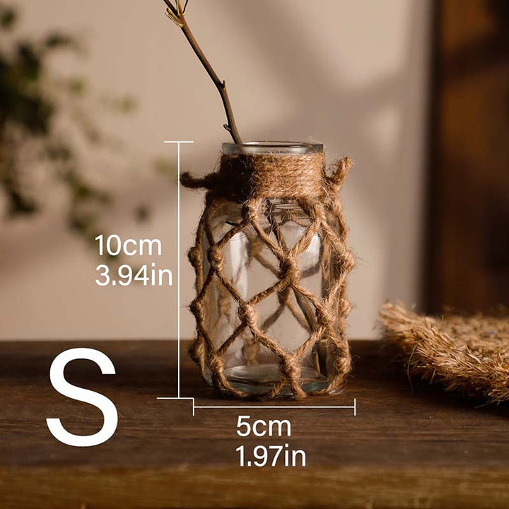 Glass vase with twine design on a wooden surface, with measurements indicated.
