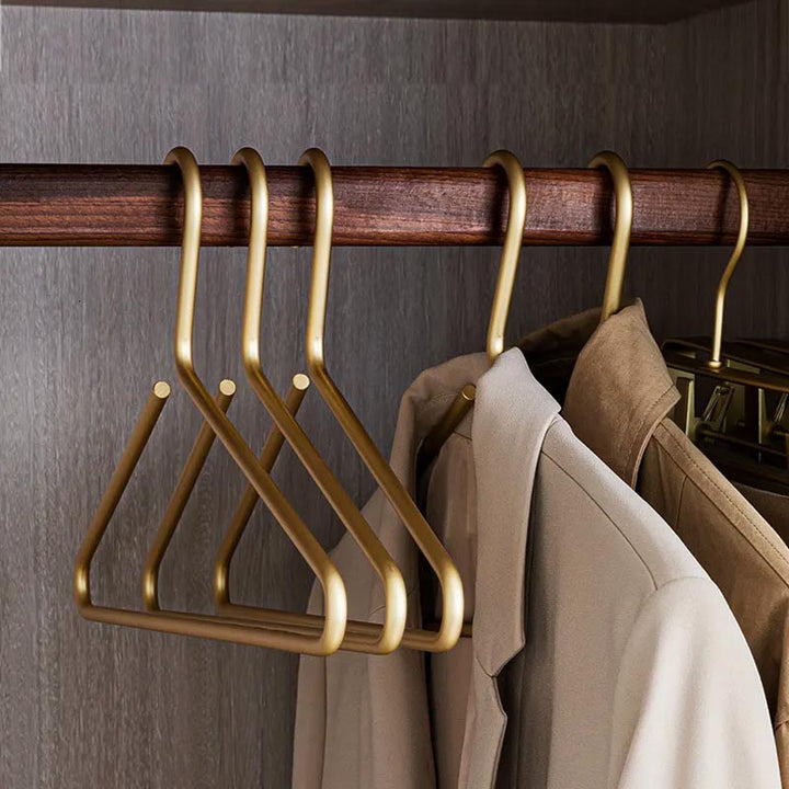 Gold metal clothes hangers set of 5, luxury slimline design, space-saving for wardrobe organisation and coat storage