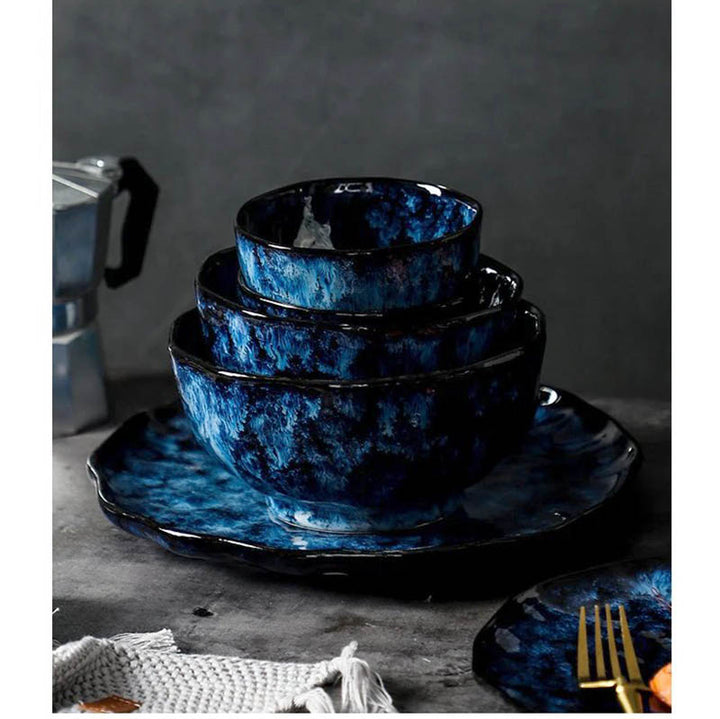 Stackable blue ceramic bowls with reactive glaze finish, part of Japandi-inspired Nordic dinnerware collection