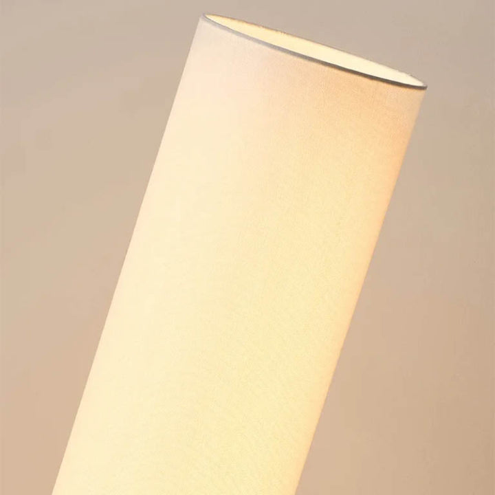 Detail view of linen-style fabric shade, softly diffusing warm light for Japandi-inspired interiors.