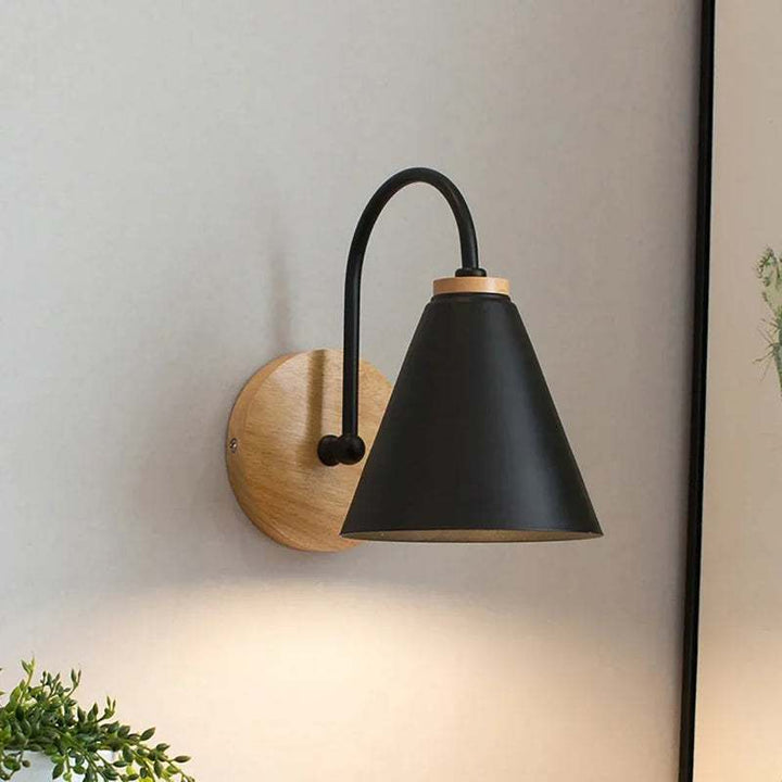 Black HYGGE Nordic Modern LED wall light with wooden base and curved arm for living room or bedroom décor
