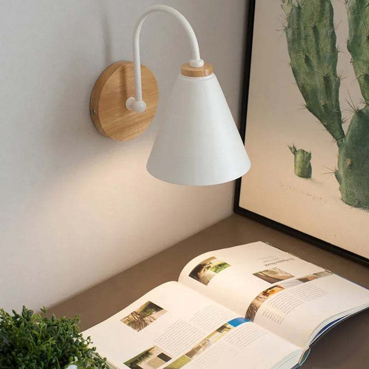 White HYGGE Nordic LED wall sconce with wooden base, ideal for reading nook or desk lighting