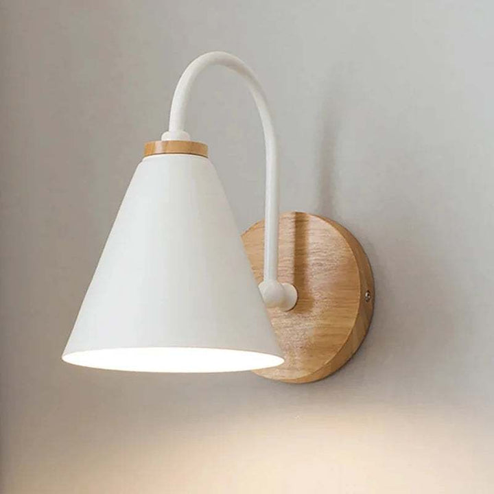 White HYGGE LED wall sconce with minimalist Scandinavian design and natural wood wall plate